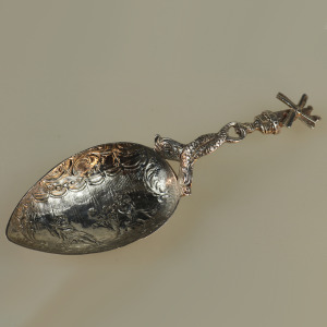A 925 solid silver Caddy Spoon with twin dolphin and windmill stem C.early 20thC
