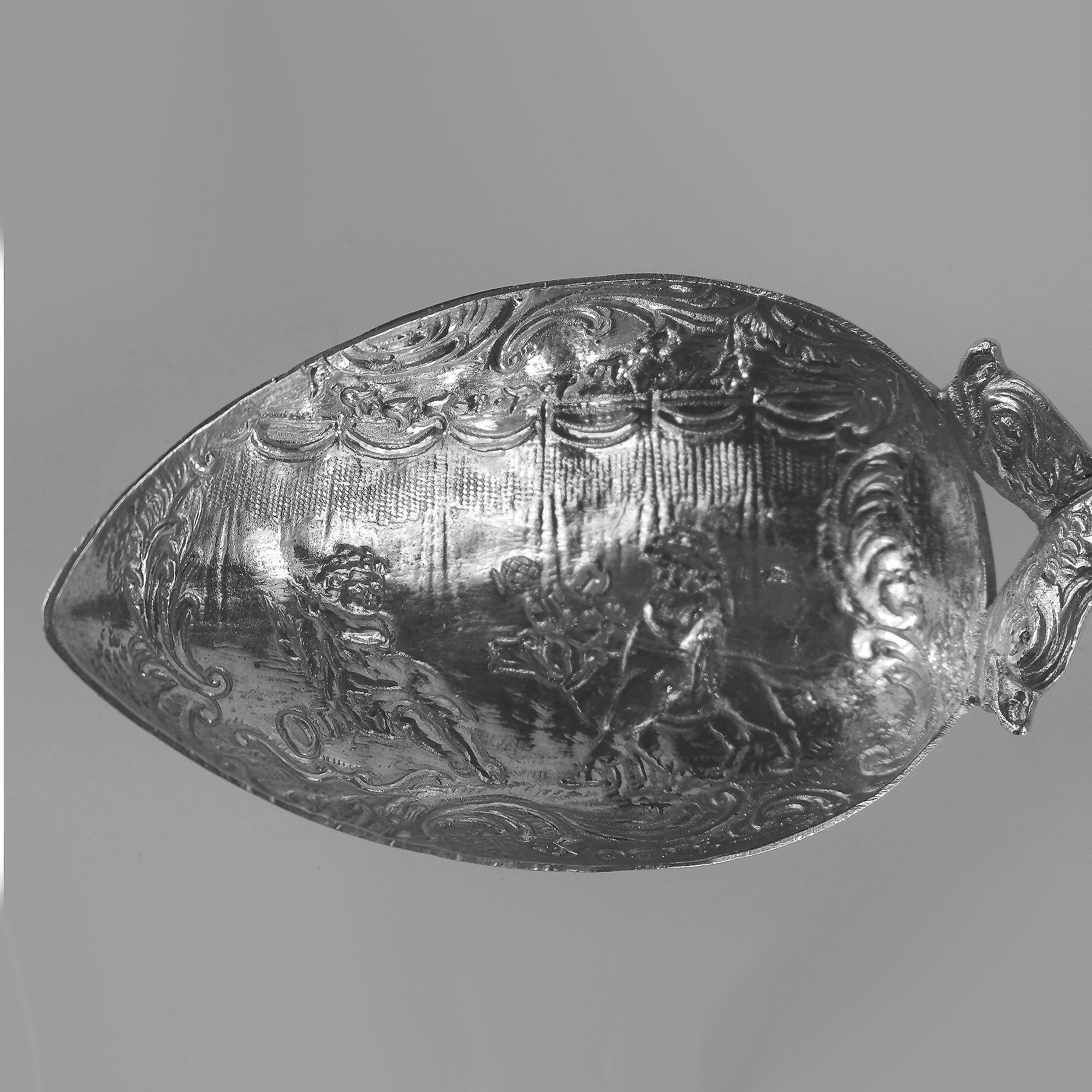 A 925 solid silver Caddy Spoon with twin dolphin and windmill stem C.early 20thC