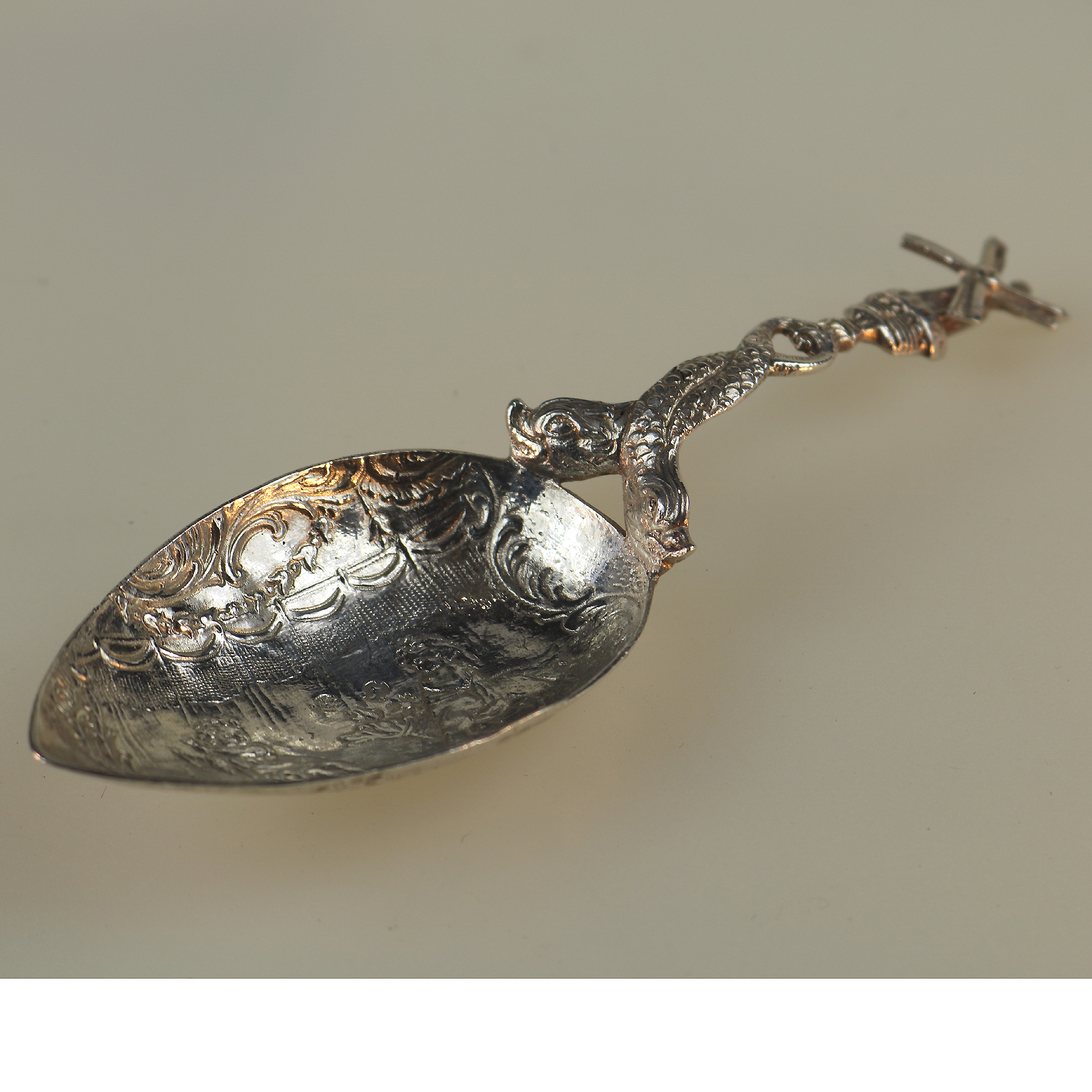 A 925 solid silver Caddy Spoon with twin dolphin and windmill stem C.early 20thC