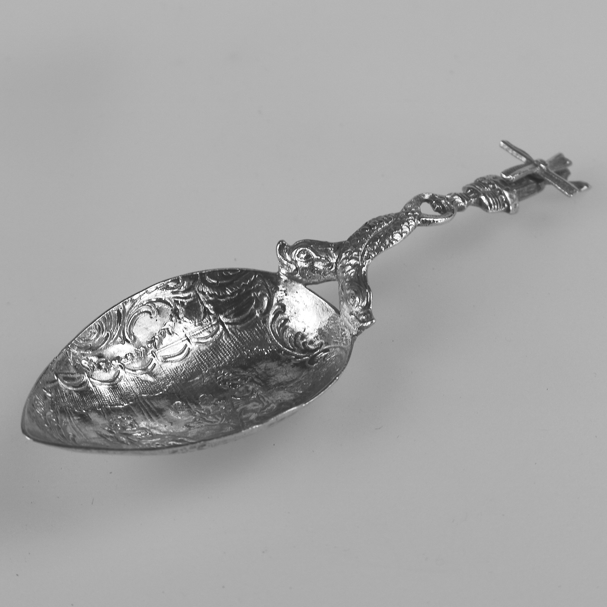 A 925 solid silver Caddy Spoon with twin dolphin and windmill stem C.early 20thC