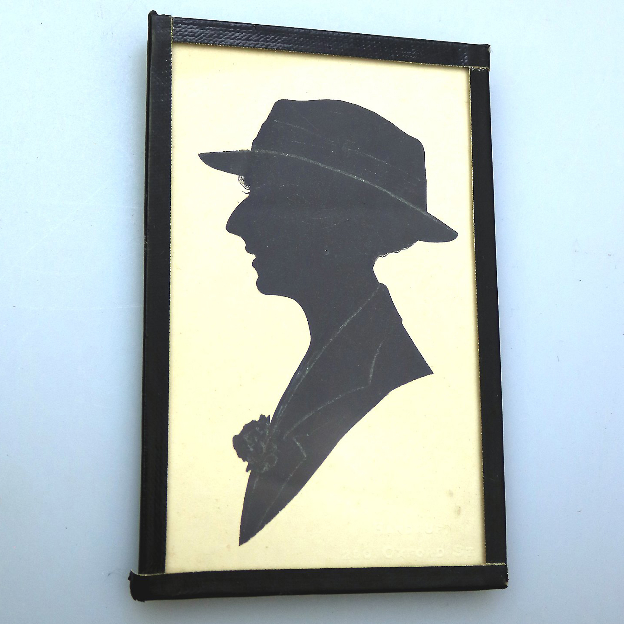 An antique Silhouette miniature picture of a lady - signed Handrup C.early 20thC