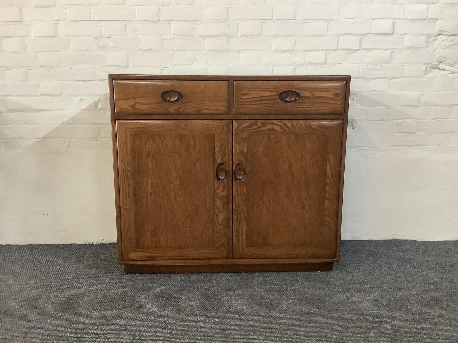 Ercol Windsor High Sideboard In Golden Dawn Finish.