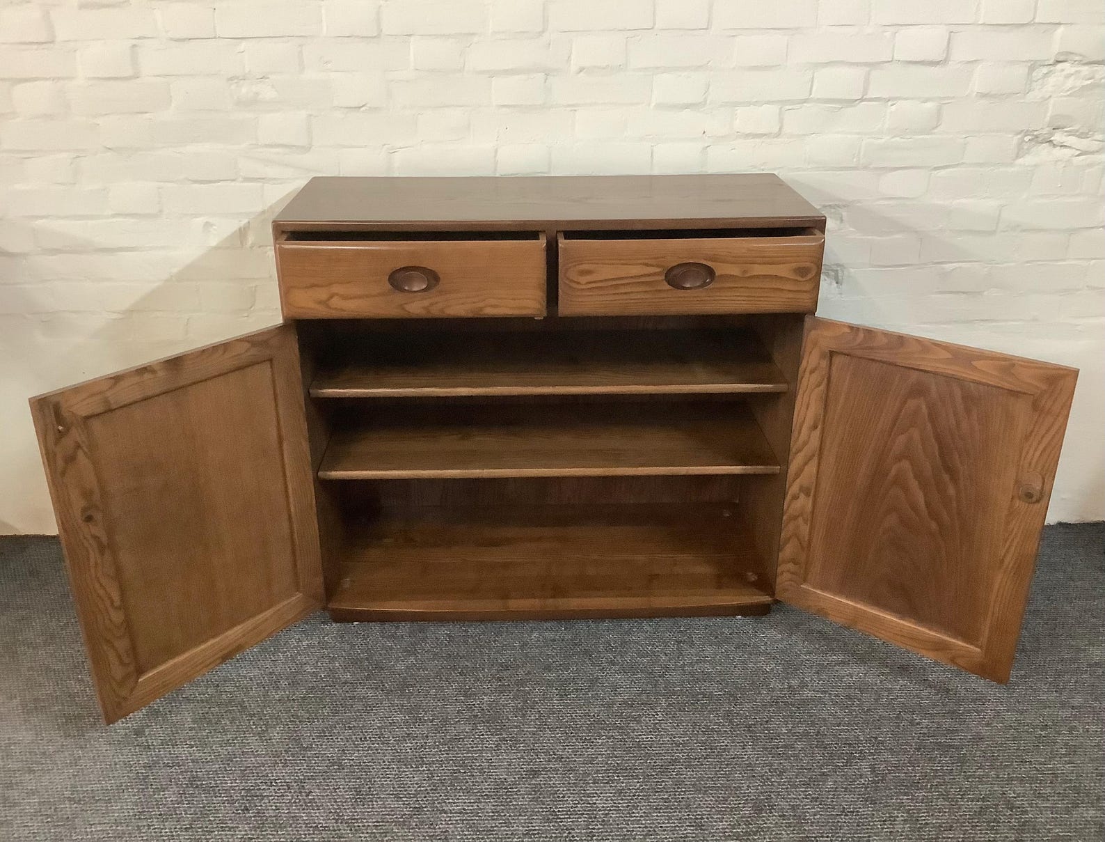Ercol Windsor High Sideboard In Golden Dawn Finish.