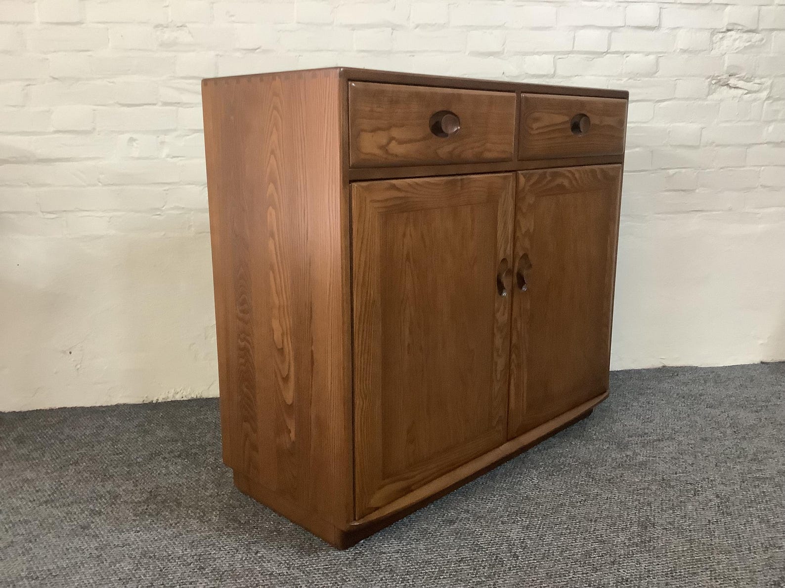 Ercol Windsor High Sideboard In Golden Dawn Finish.