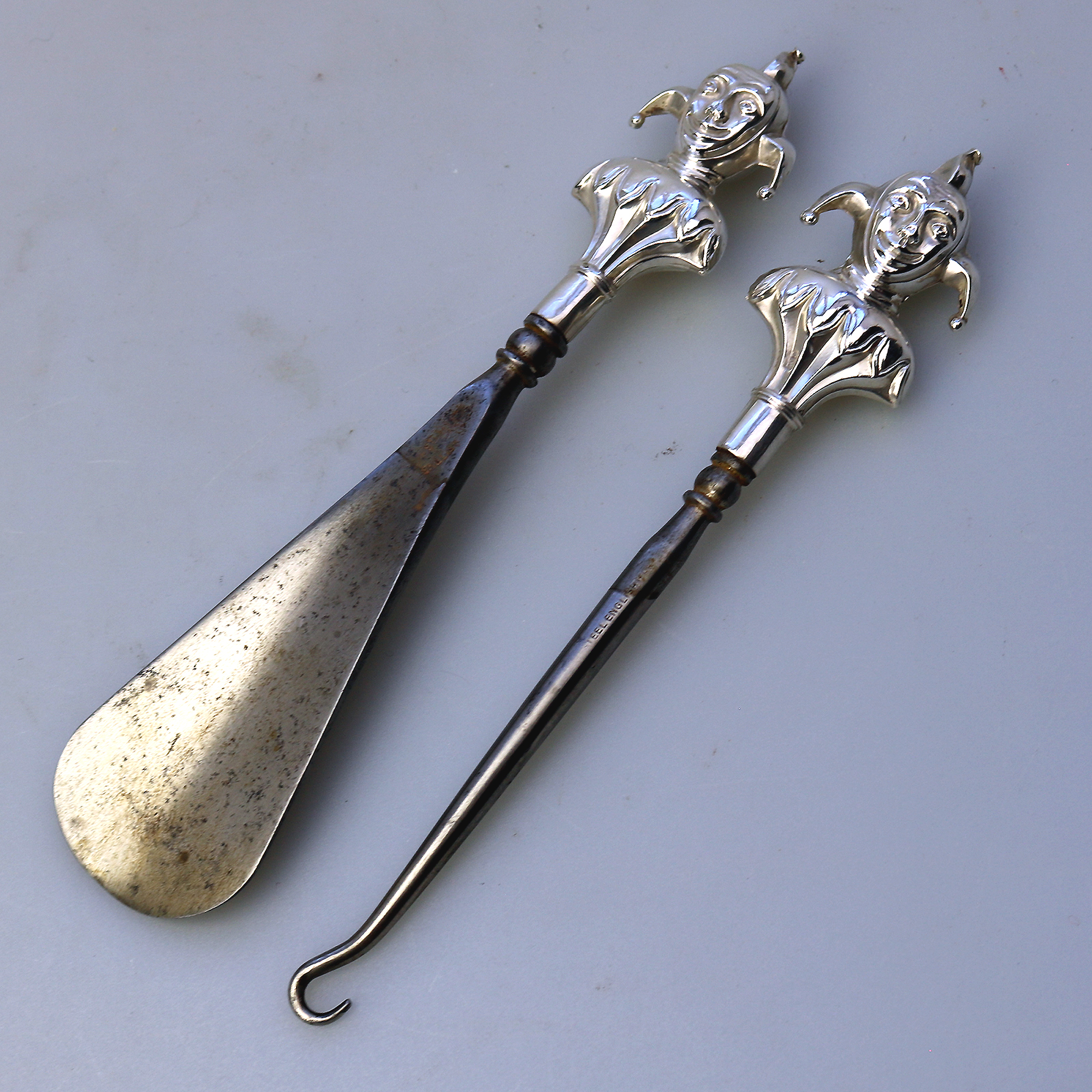 A pair antique English solid silver novelty Jester Button Hook & Shoe Horn C.1909