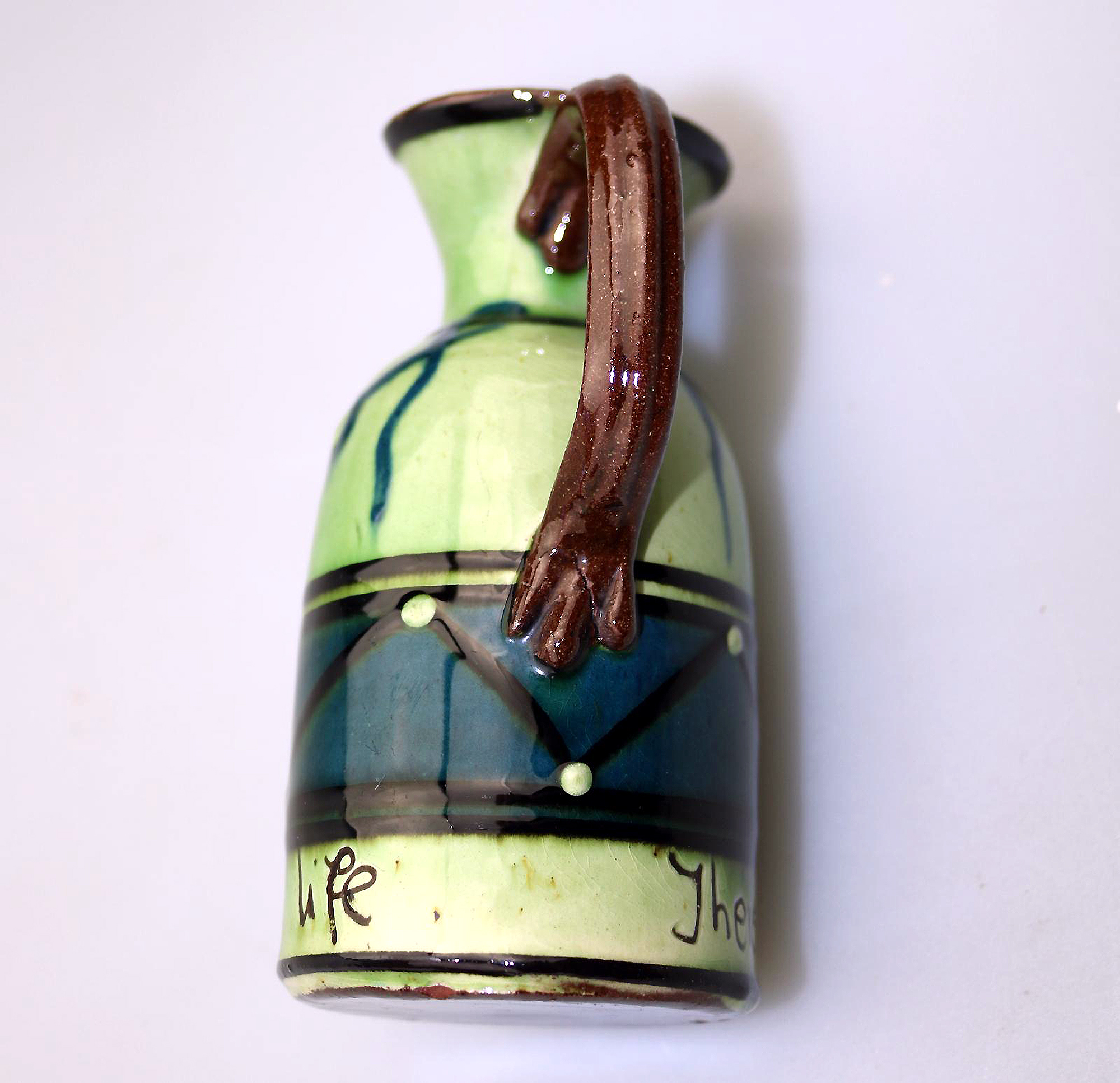 An unusual arts & crafts Art Pottery Torquay Devon Motto Creamer Jug C.1900