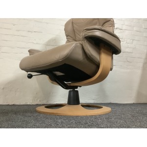 Stressless Reclining Swivel Chair And Footstool In Leather.
