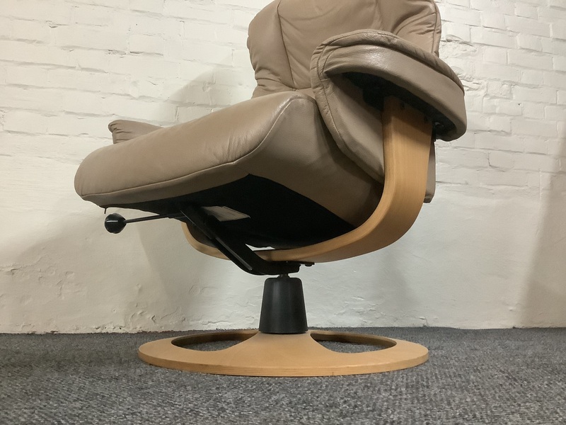 Stressless Reclining Swivel Chair And Footstool In Leather.