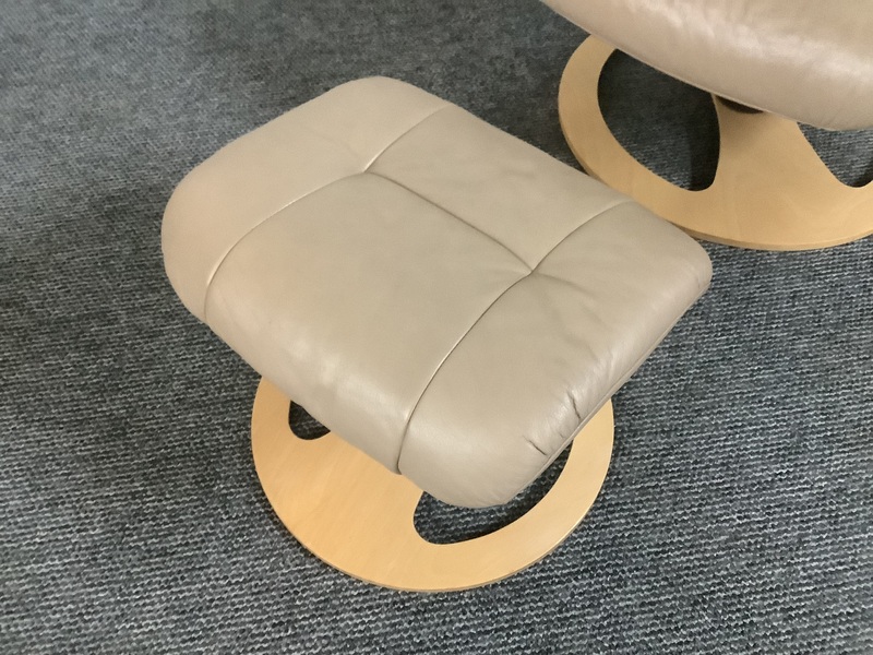 Stressless Reclining Swivel Chair And Footstool In Leather.