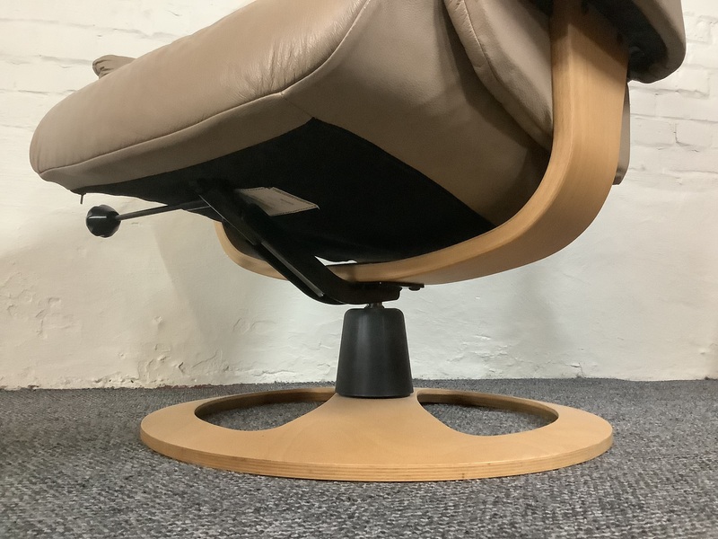 Stressless Reclining Swivel Chair And Footstool In Leather.