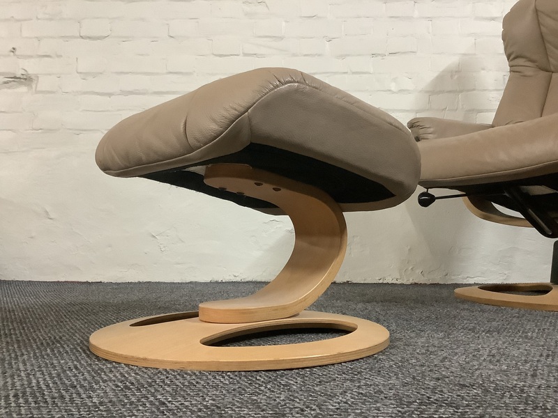 Stressless Reclining Swivel Chair And Footstool In Leather.