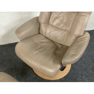 Stressless Reclining Swivel Chair And Footstool In Leather.