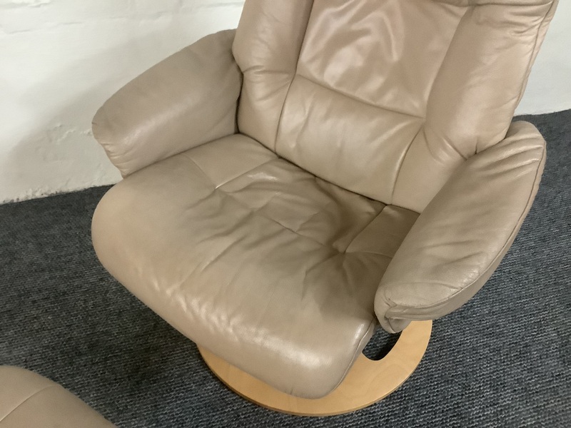 Stressless Reclining Swivel Chair And Footstool In Leather.