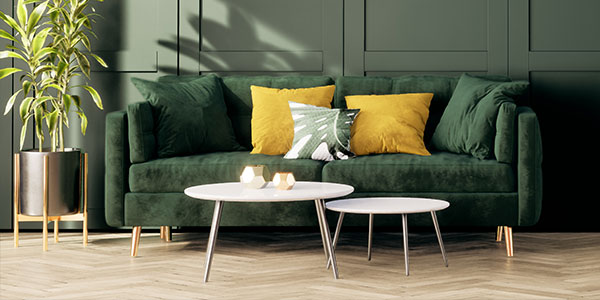 Interior design with green sofa and yellow vintage cushions
