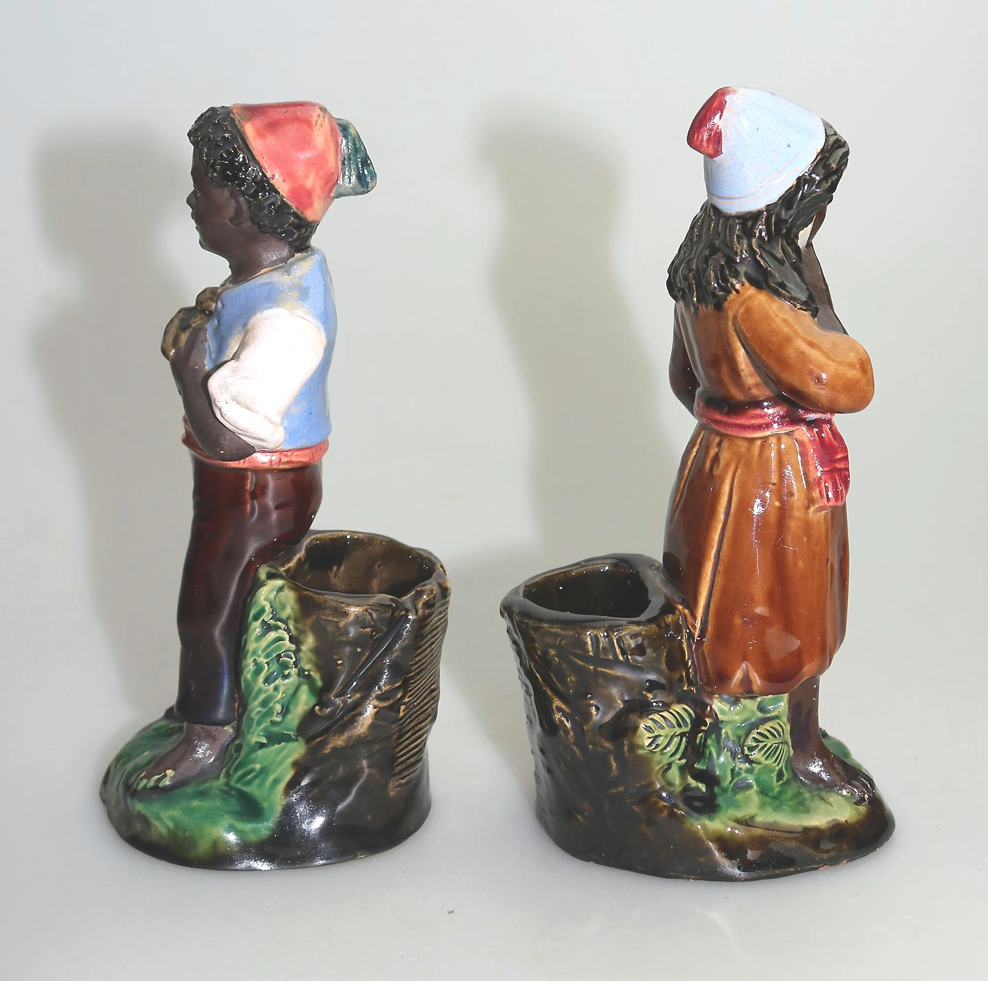 A pair antique majolica Bernhard Bloch pottery Children Figural Strikers C.19thC