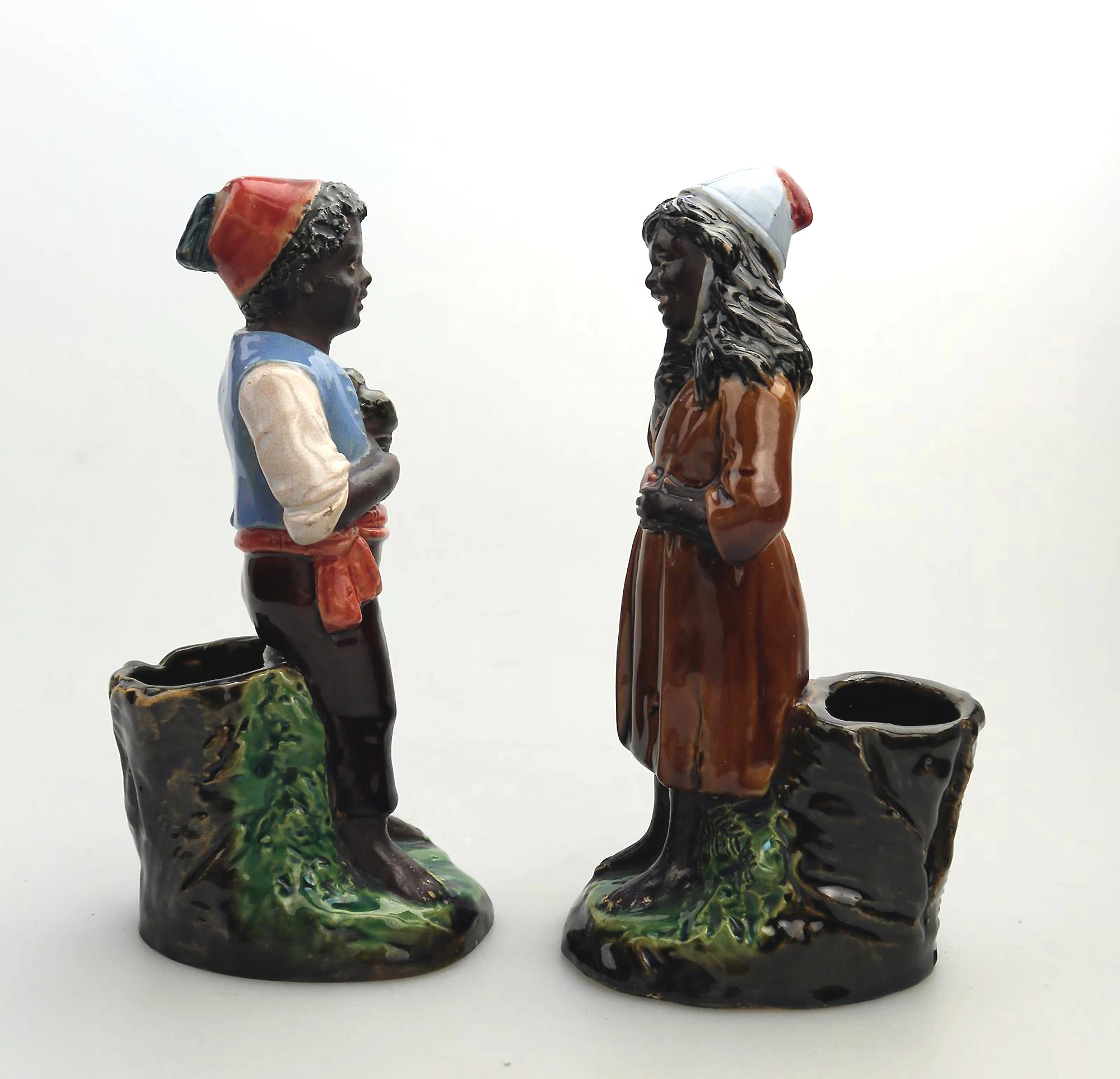A pair antique majolica Bernhard Bloch pottery Children Figural Strikers C.19thC