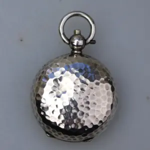 A scarce antique novelty golf ball English solid silver Sovereign Case C.1914
