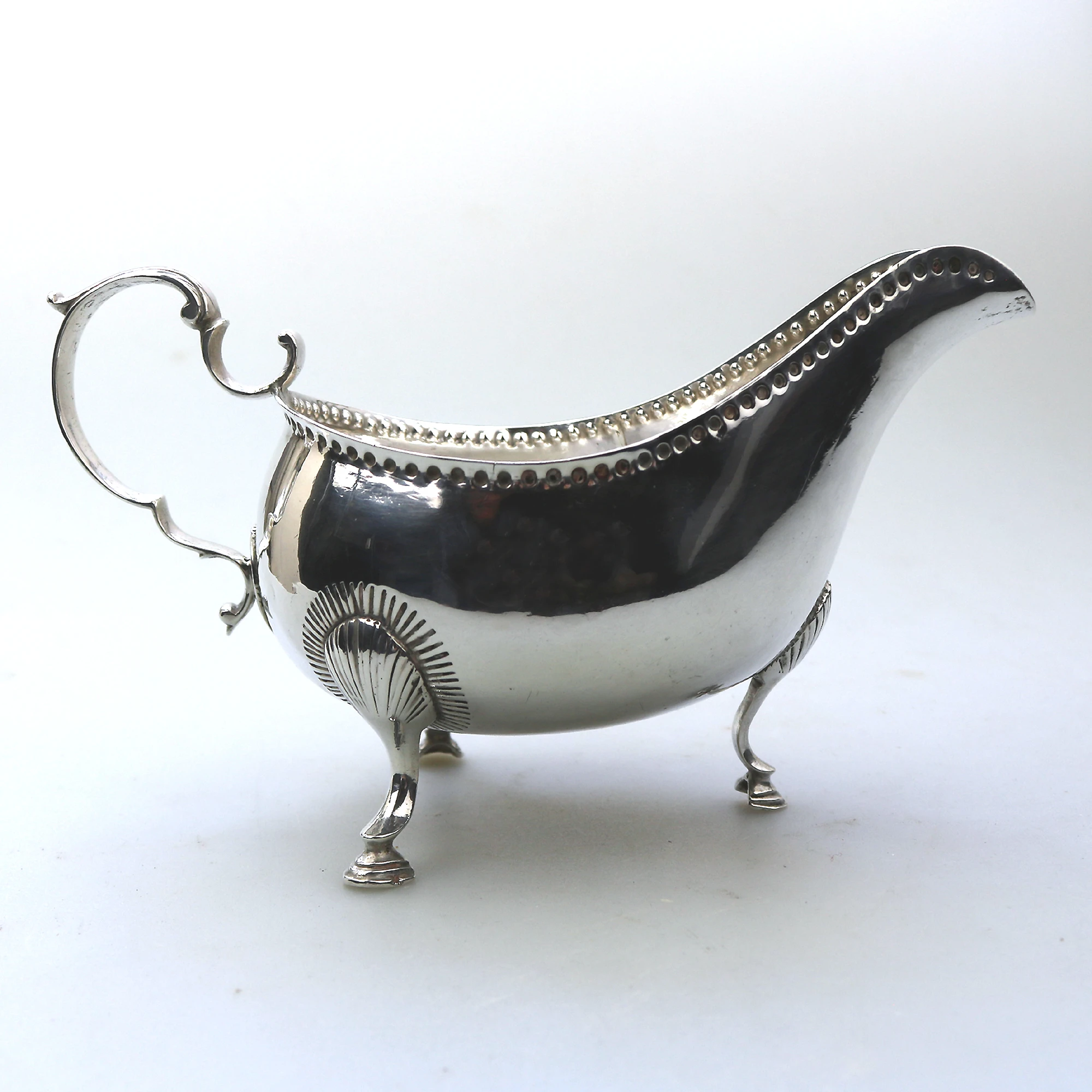 An antique Georgian Irish solid silver Sauceboat Gravy Jug by Mathew West C.1789