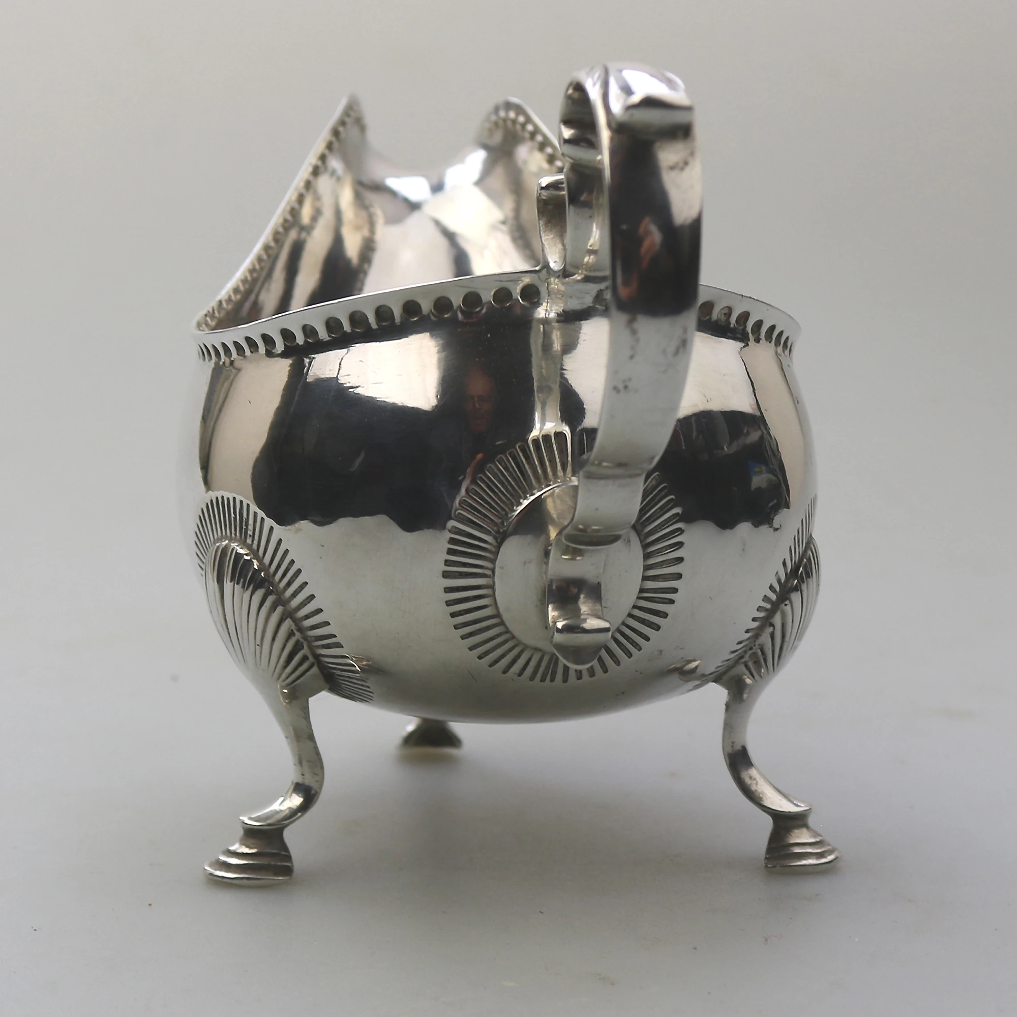 An antique Georgian Irish solid silver Sauceboat Gravy Jug by Mathew West C.1789
