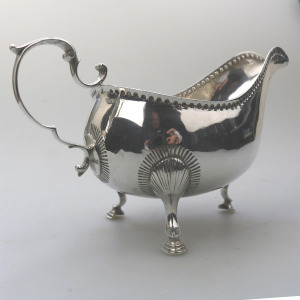 An antique Georgian Irish solid silver Sauceboat Gravy Jug by Mathew West C.1789