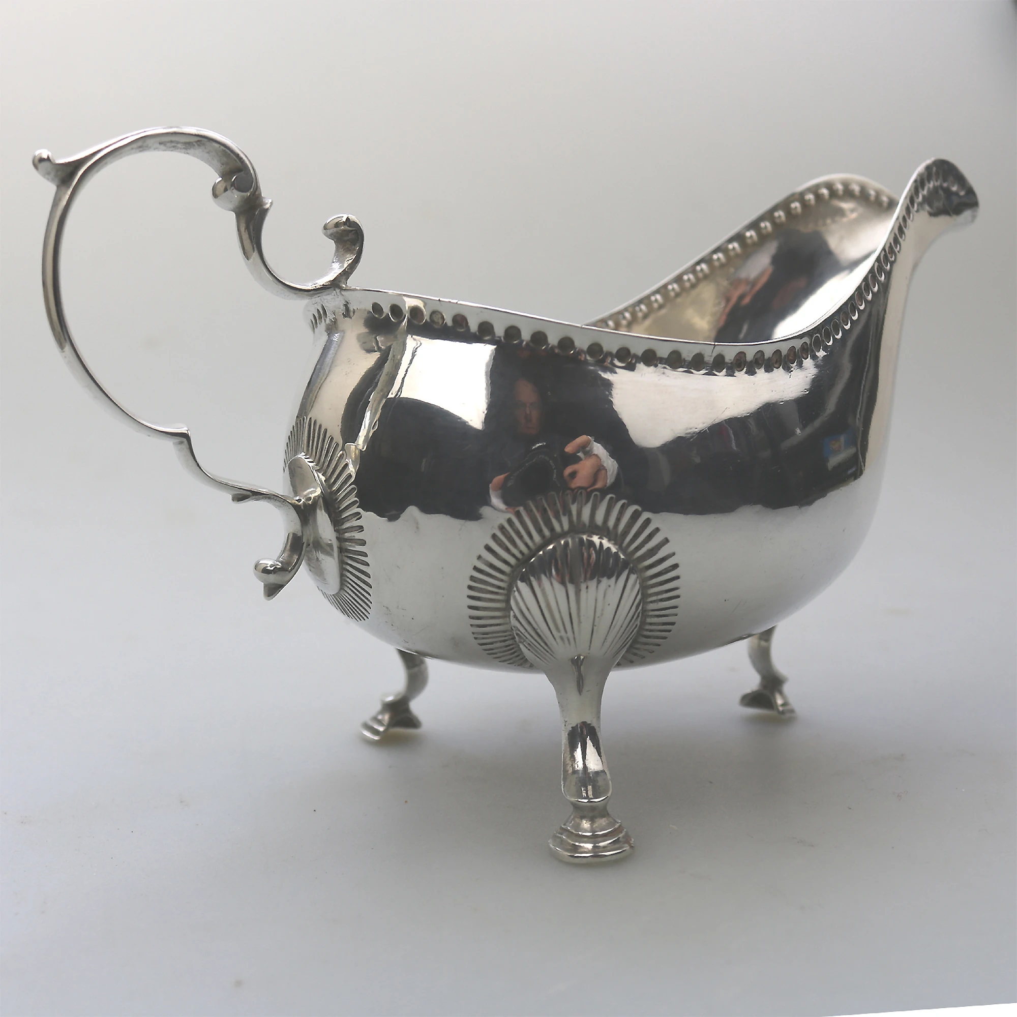 An antique Georgian Irish solid silver Sauceboat Gravy Jug by Mathew West C.1789