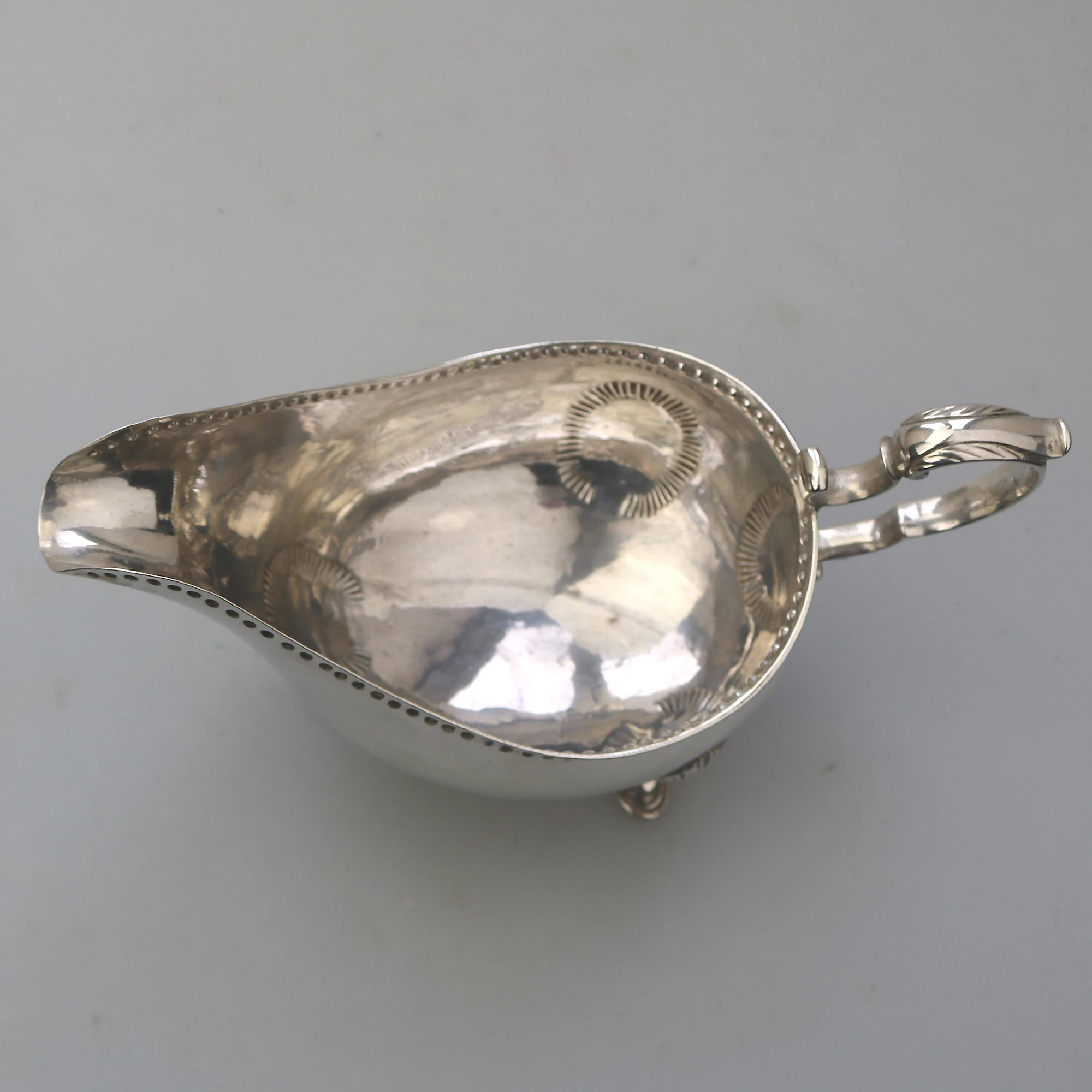 An antique Georgian Irish solid silver Sauceboat Gravy Jug by Mathew West C.1789