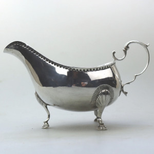 An antique Georgian Irish solid silver Sauceboat Gravy Jug by Mathew West C.1789