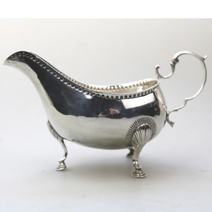 An antique Georgian Irish solid silver Sauceboat Gravy Jug by Mathew West C.1789