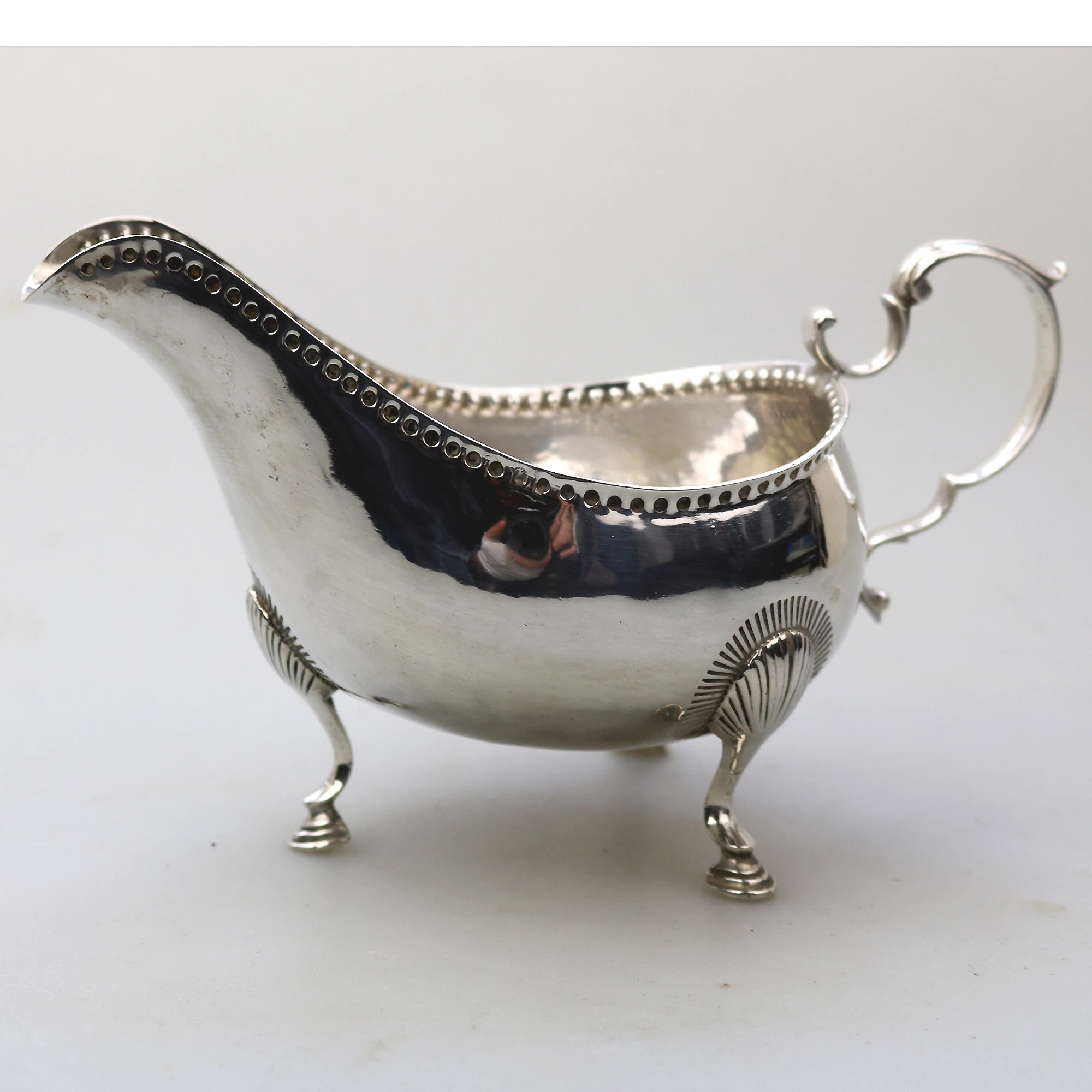 An antique Georgian Irish solid silver Sauceboat Gravy Jug by Mathew West C.1789