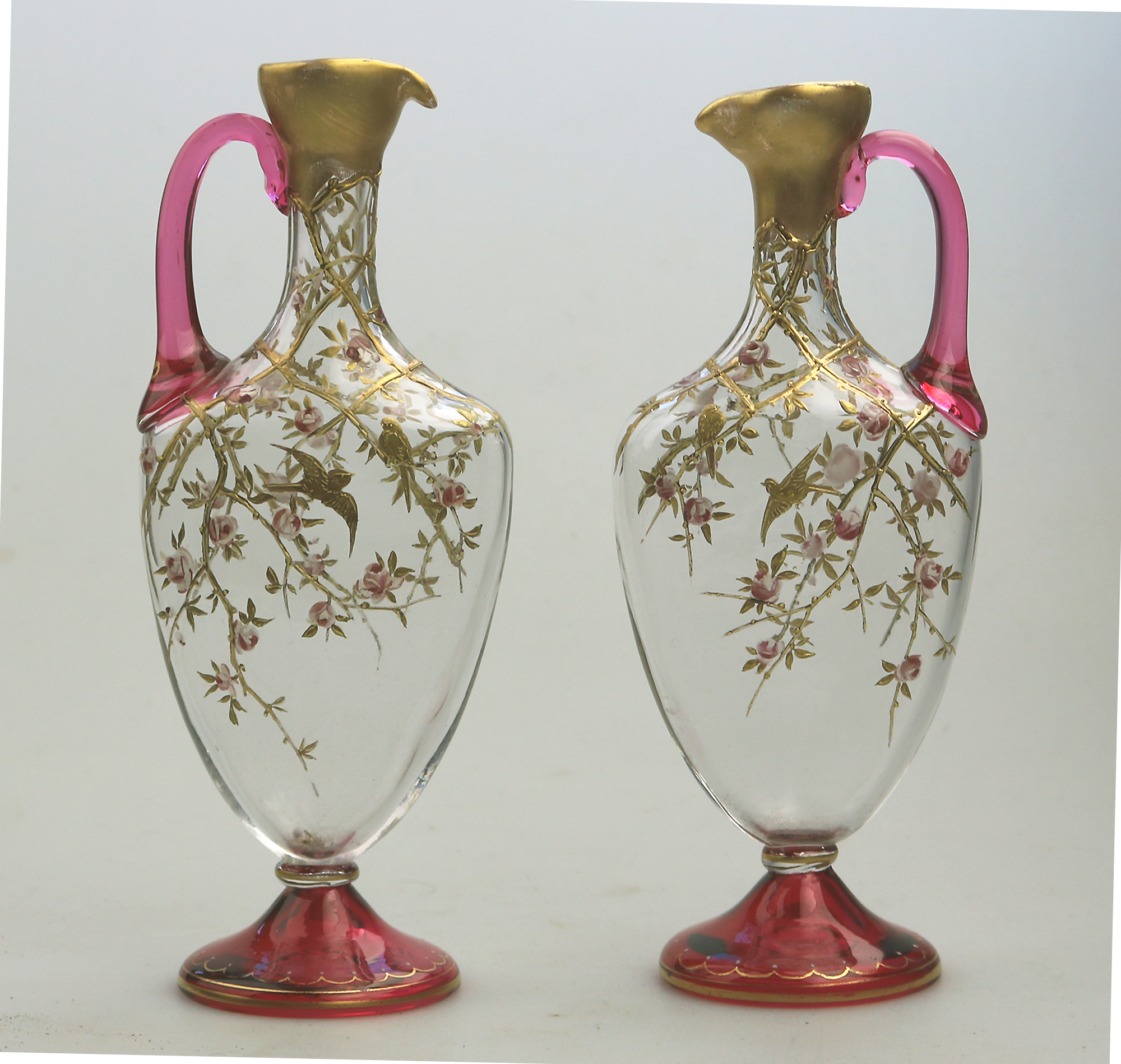 A superb pair antique cranberry glass & gilt overlaid Moser type Ewers C.19thC