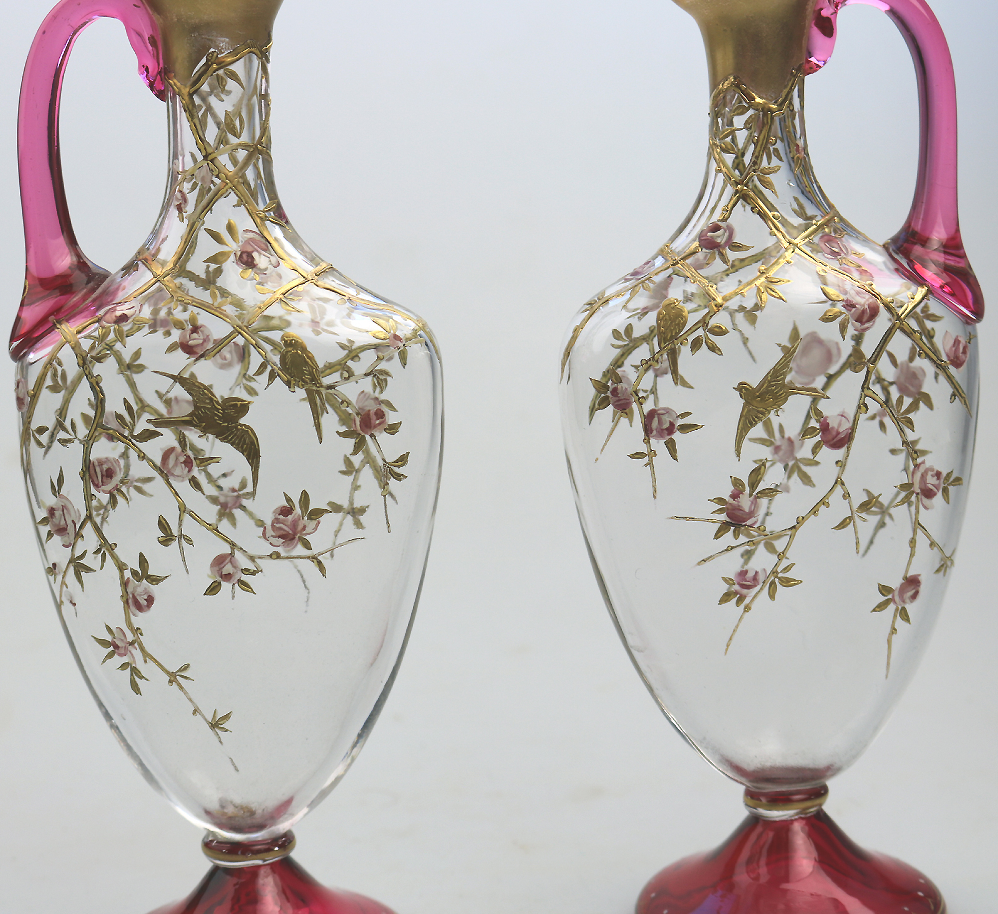A superb pair antique cranberry glass & gilt overlaid Moser type Ewers C.19thC