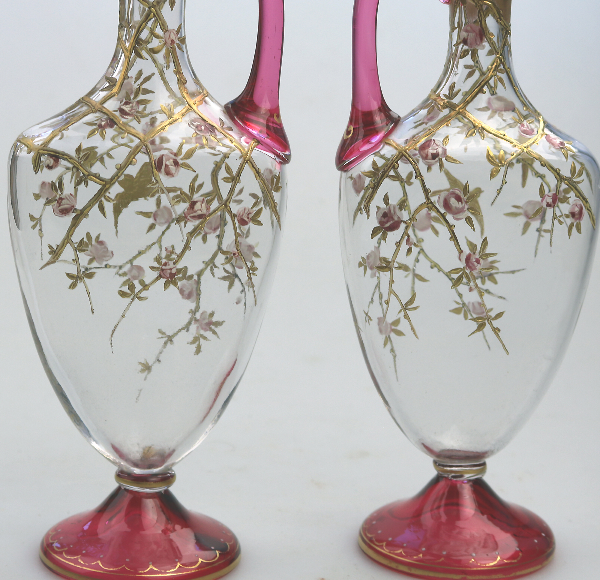 A superb pair antique cranberry glass & gilt overlaid Moser type Ewers C.19thC