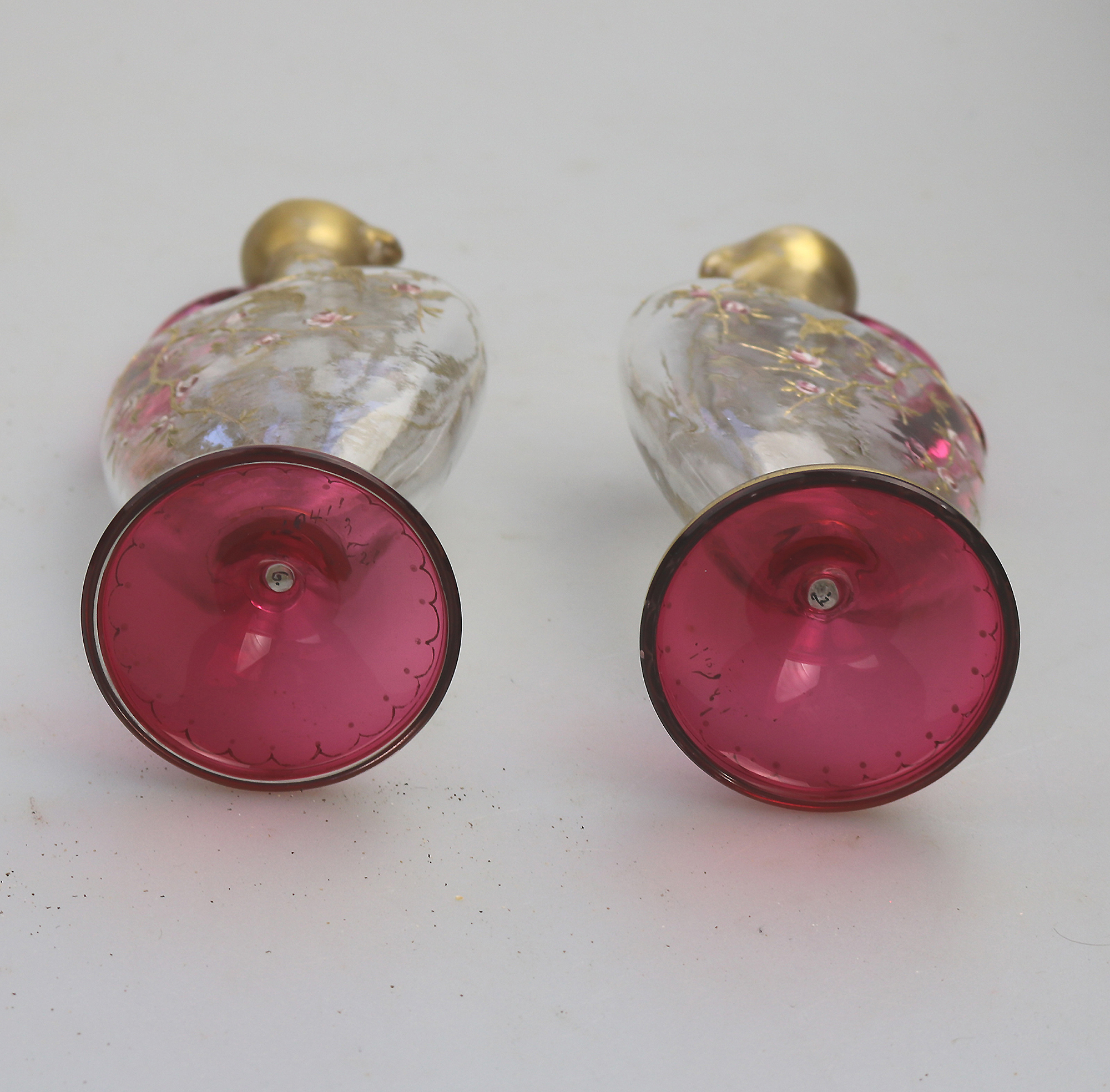 A superb pair antique cranberry glass & gilt overlaid Moser type Ewers C.19thC