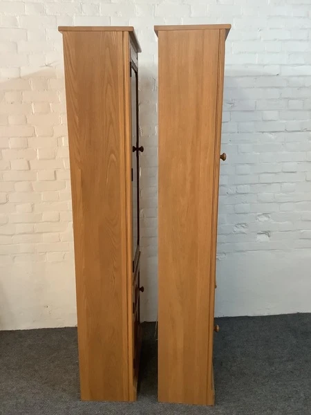 Pair Of Ercol Mural Glazed Cabinets In Light Finish.