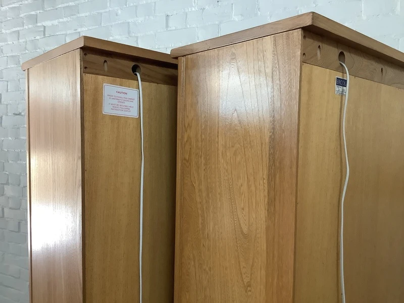 Pair Of Ercol Mural Glazed Cabinets In Light Finish.