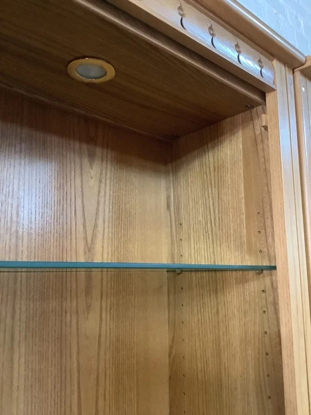 Pair Of Ercol Mural Glazed Cabinets In Light Finish.