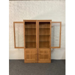 Pair Of Ercol Mural Glazed Cabinets In Light Finish.