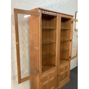 Pair Of Ercol Mural Glazed Cabinets In Light Finish.