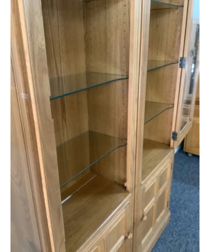 Pair Of Ercol Mural Glazed Cabinets In Light Finish.