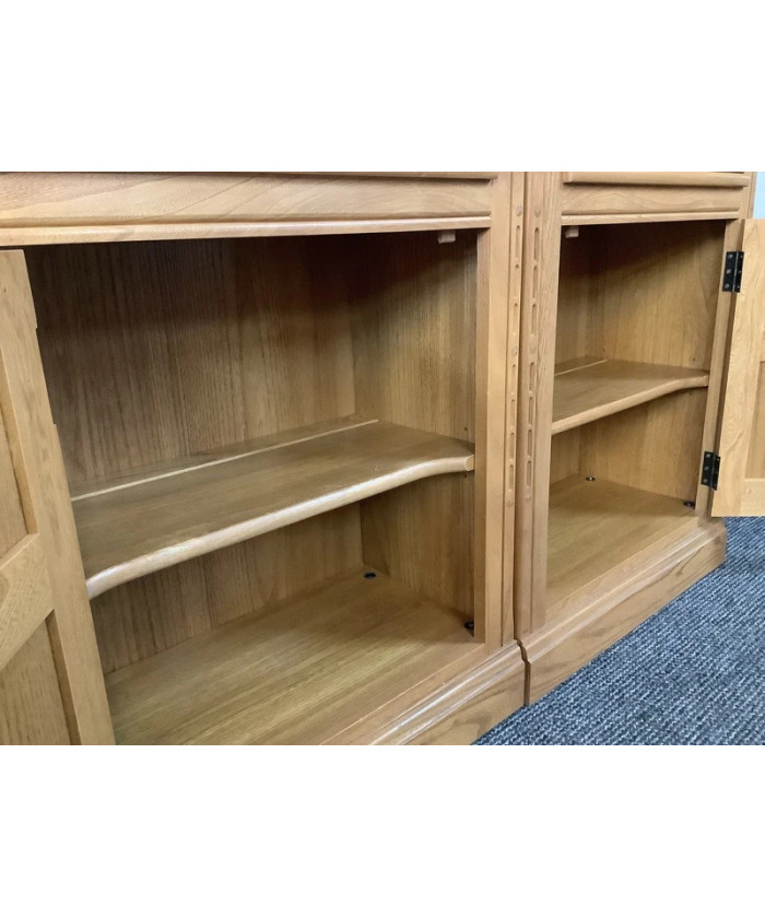 Pair Of Ercol Mural Glazed Cabinets In Light Finish.