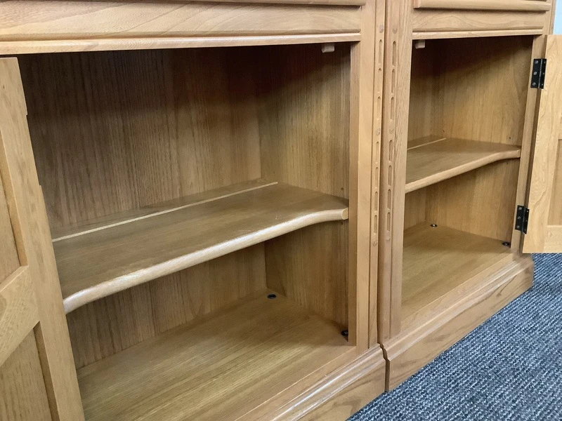 Pair Of Ercol Mural Glazed Cabinets In Light Finish.