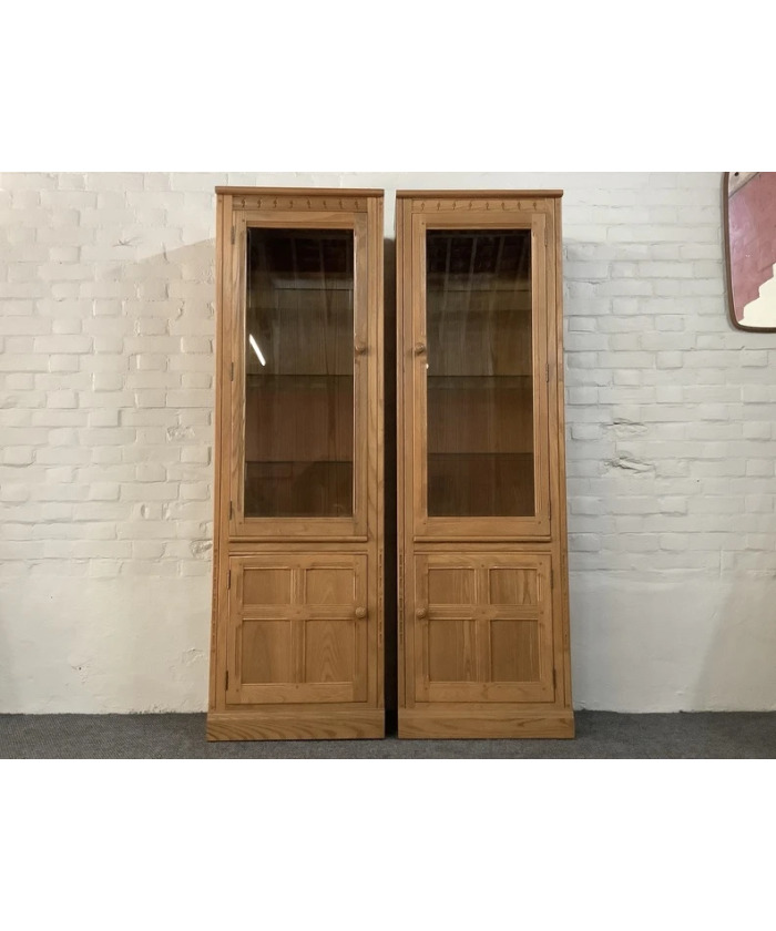 Pair Of Ercol Mural Glazed Cabinets In Light Finish.