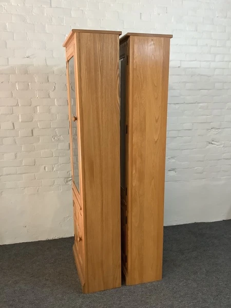 Pair Of Ercol Mural Glazed Cabinets In Light Finish.
