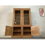 Pair Of Ercol Mural Glazed Cabinets In Light Finish.