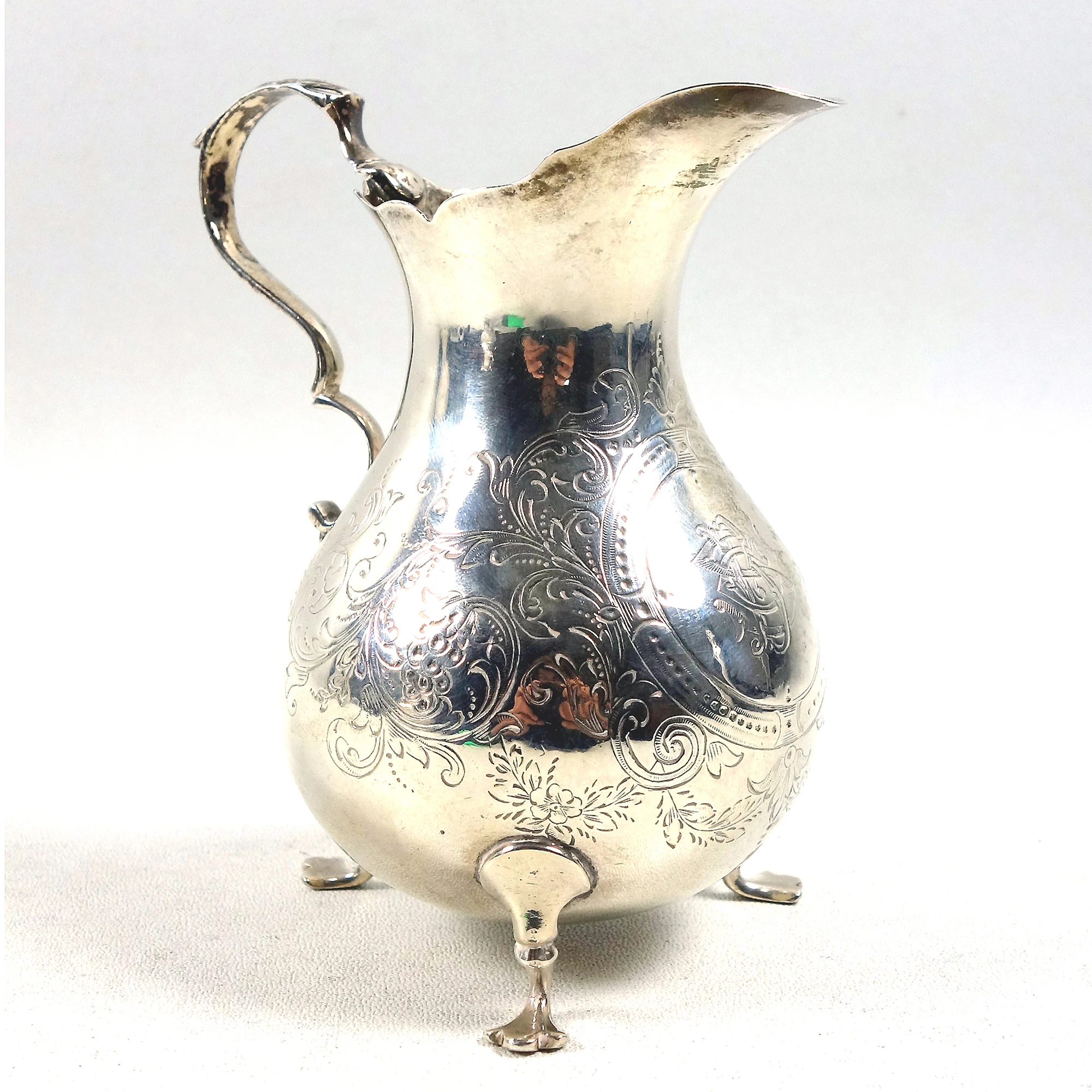 A good antique Victorian English solid silver floral engraved Jug 117g C.1870